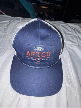 AFTCO Navy and White Mesh Patch Trucker Hat with Orange Logo